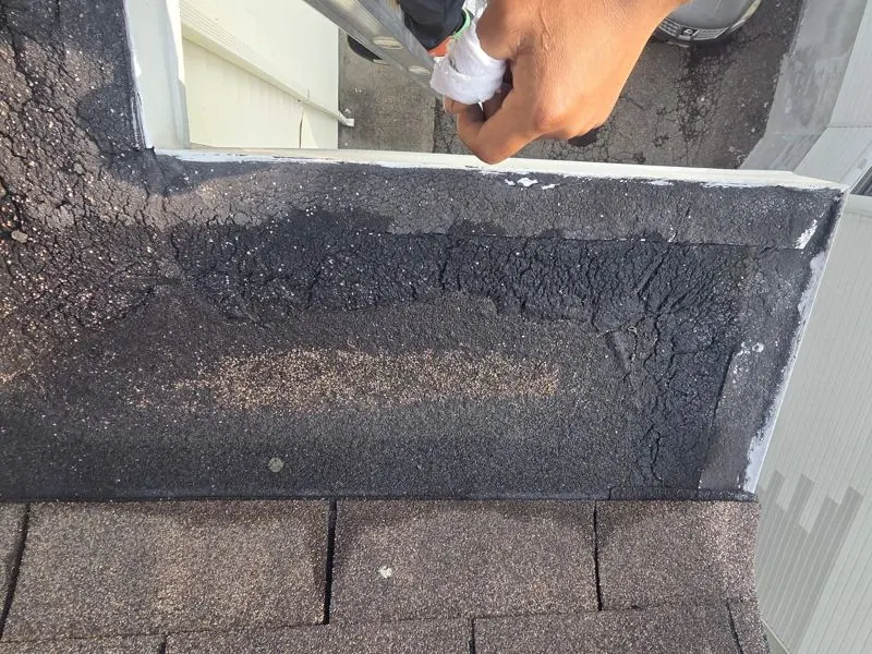 Applying sealant at roof to wall joint