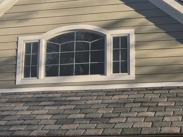 Arched window with white trim wrap