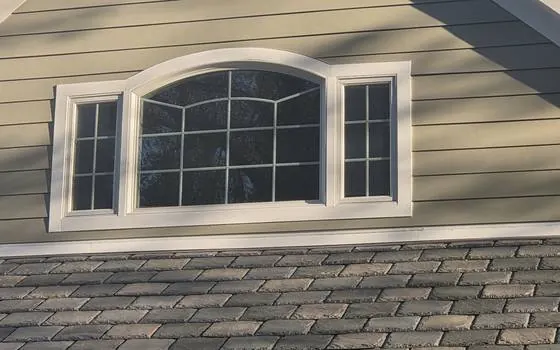 Arched window with white trim wrap