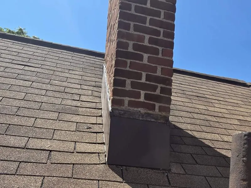 Brick chimney with new flashing