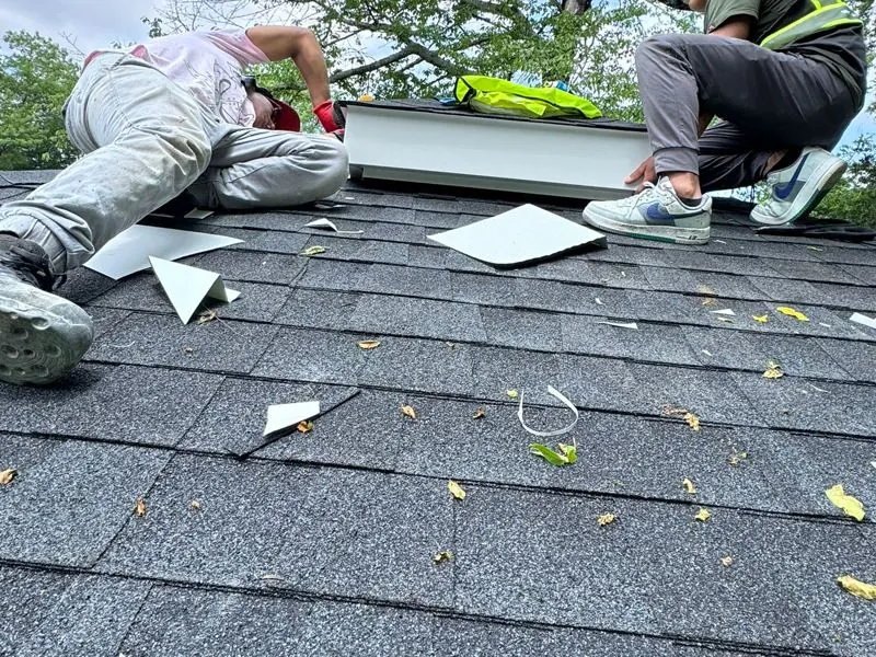 Crew installing new shingles