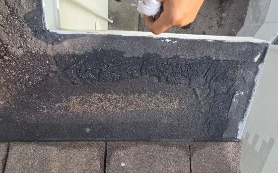Roof repair with sealant at wall joint