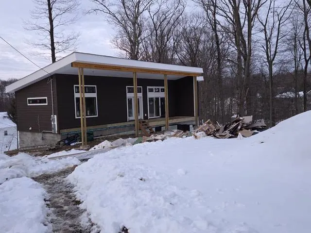 White soffit and fascia on a brown home