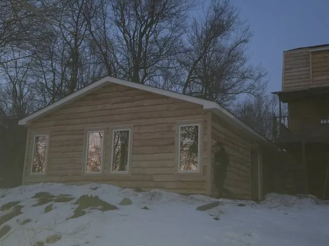 Wood siding with new windows at dusk